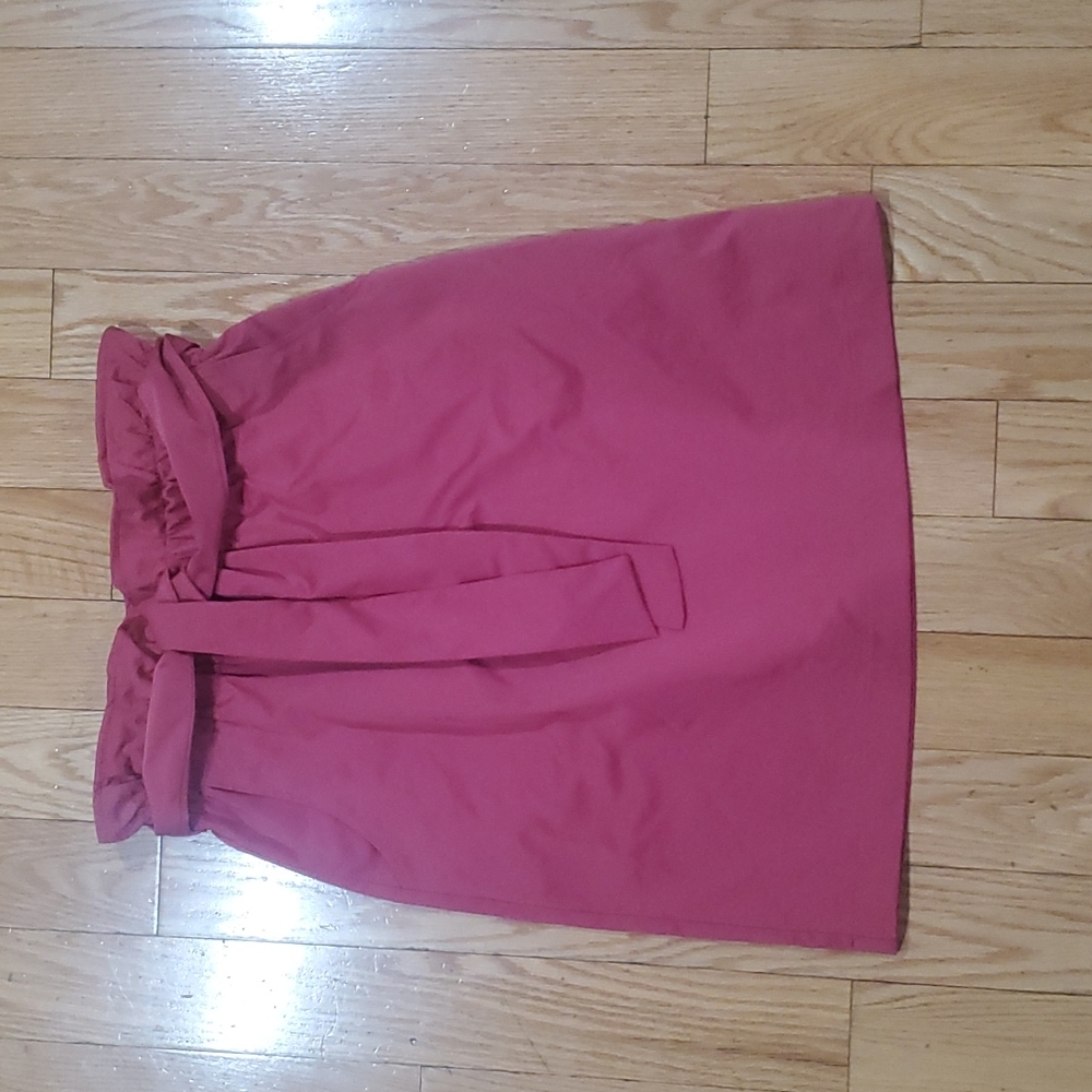 Brand new Burgundy knee length skirt with belt